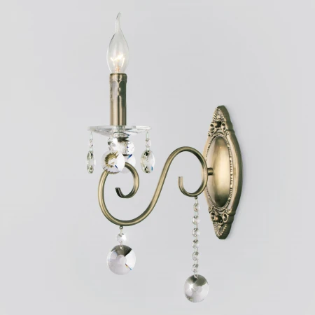 Классическое бра с хрусталем Eurosvet 10104/1 античная бронза/прозрачный хрусталь Strotskis